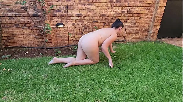 Nude small boobs big ass BBW pissing on a rose tree outside in the garden