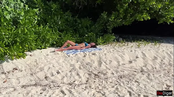 Pissed on girl on a public beach - She was shocked