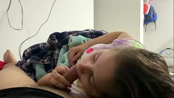 My little stepdaughter plays with my cock in her mouth while we watch a movie (She doesn't know I recorded it)